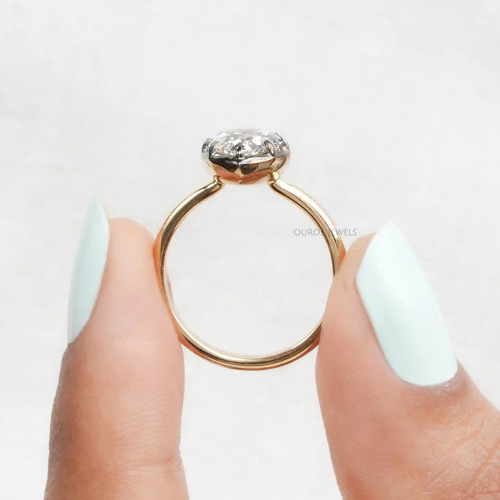 close up view of antique old cut pear shaped diamond engagement ring