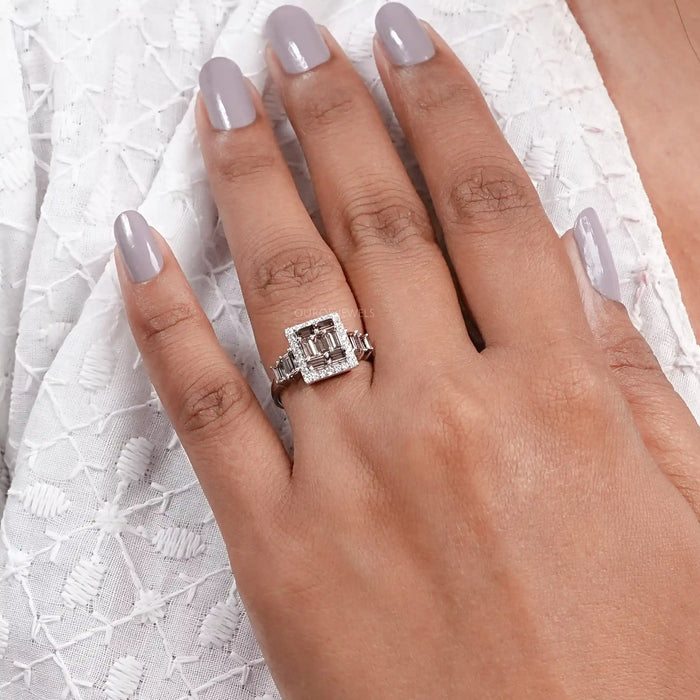 brown baguette diamond cluster square halo engagement ring on model's finger