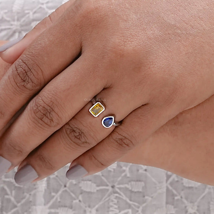 yellow emerald and blue pear cut gemstone bezel set open cuff ring in finger