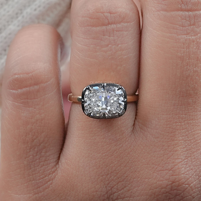 top view of east west cushion cut lab diamond black coating engagement ring