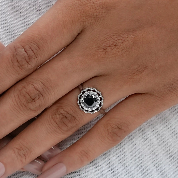 round black lab diamond double halo engagement ring on model's hand