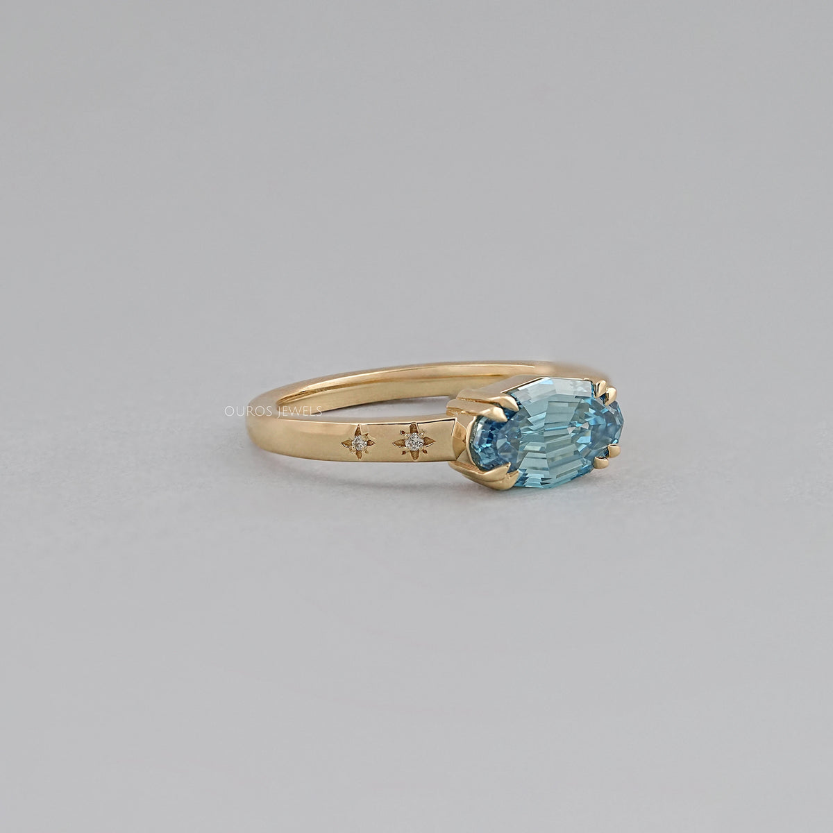 East-West Blue Step Cut Oval Accent Diamond Ring Rings