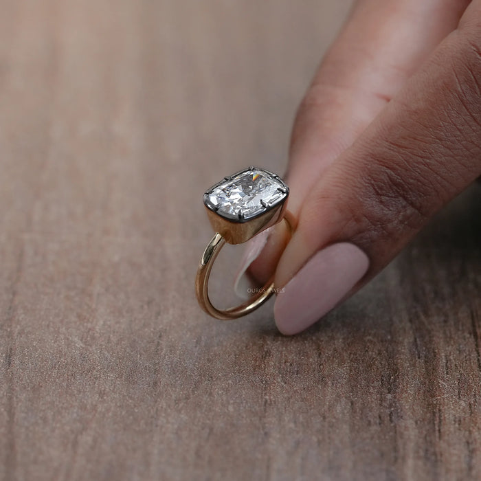 side view of east west cushion diamond black coating solitaire engagement ring