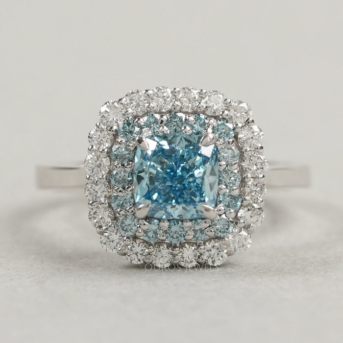front view of fancy blue cushion cut lab diamond double halo wedding ring