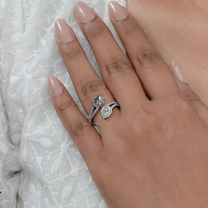 fancy vivid green pear cut lab diamond bypass halo ring in finger