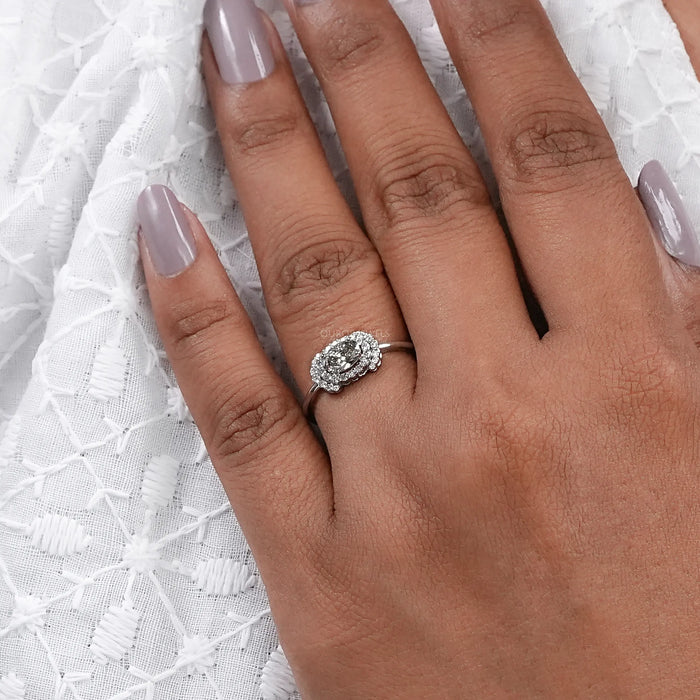 olive oval cut lab diamond halo engagement ring in finger