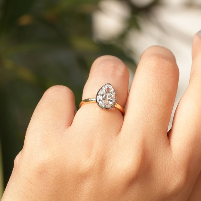 antique old cut pear shaped diamond engagement ring on model's hand