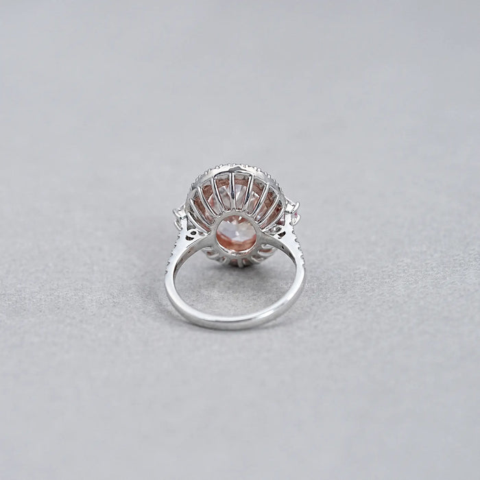back view of pink oval lab diamond with trapezoid halo diamond ring