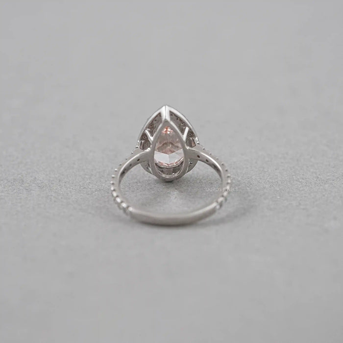 back view of pink pear cut diamond halo anniversary ring