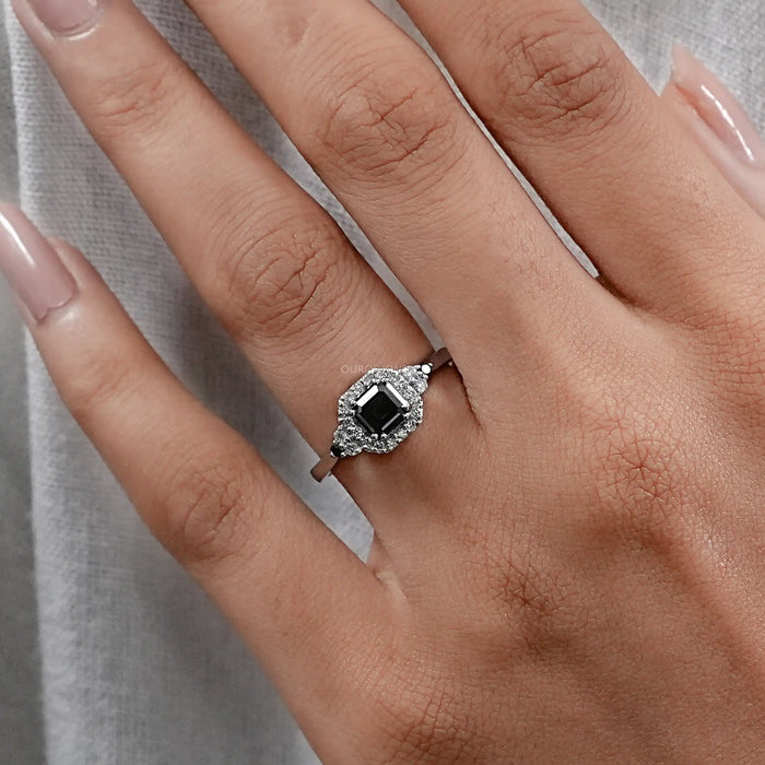 asscher cut black lab diamond halo engagement ring in finger