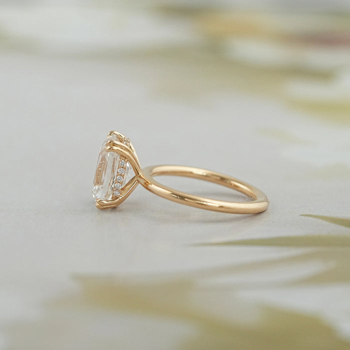 left side of old mine cushion diamond double prong hidden halo engagement ring