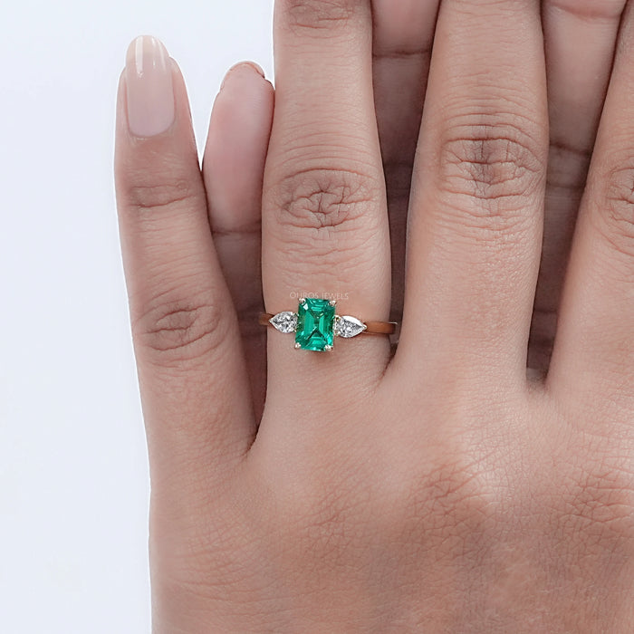 Emerald Gemstone And Pear Diamond Trio Engagement Ring