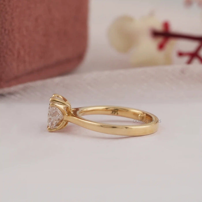 side view of pink butterfly shape diamond solitaire proposal ring