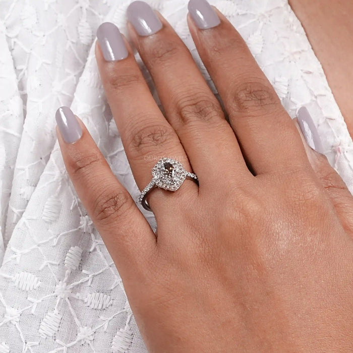 brown oval cut lab diamond double halo engagement ring in finger