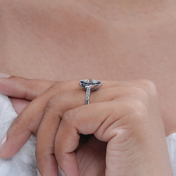 OEC Round Diamond Surround Sapphire Baguette Halo Ring