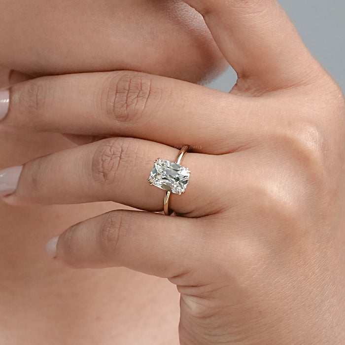 old mine cushion diamond double prong engagement ring on model's hand