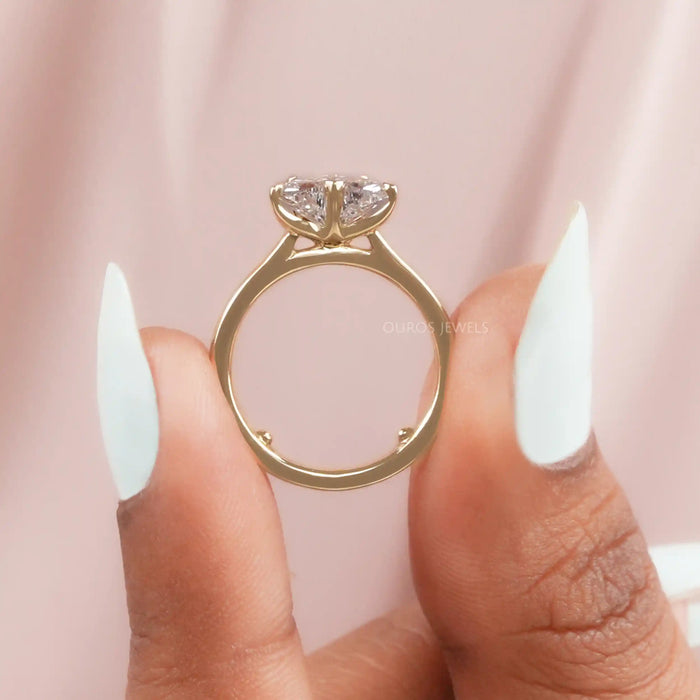 close up view of pink butterfly shape diamond solitaire proposal ring