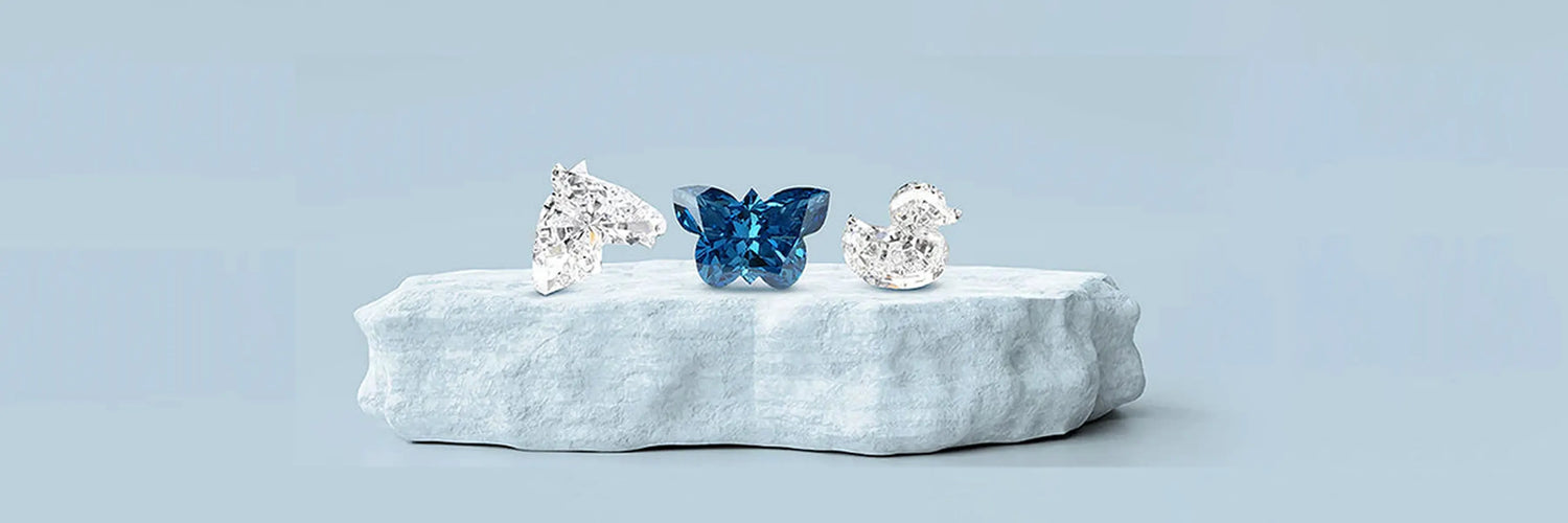  image showing antique-shaped lab-grown diamonds cut in the shapes of a duck, butterfly, and horse