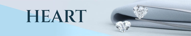 heart shaped lab grown diamond holded with tweezer