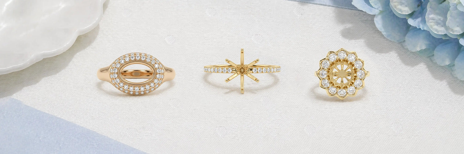 A luxurious custom-made semi-mount engagement ring set, featuring three rings in silver and gold metal tones, designed for a personalized touch