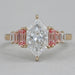 front view of dutch marquise cut with baguette diamond engagement ring on fabric