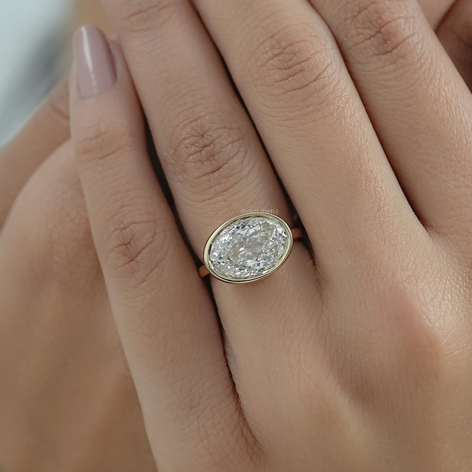 East West Portuguese Oval Bezel Set Engagement Ring Ring