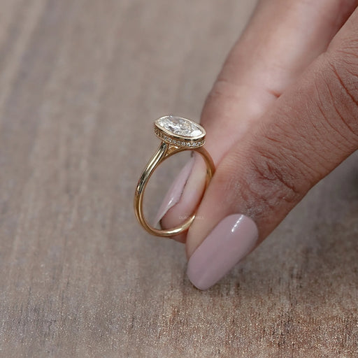 side view of oval diamond hidden halo bezel set engagement ring