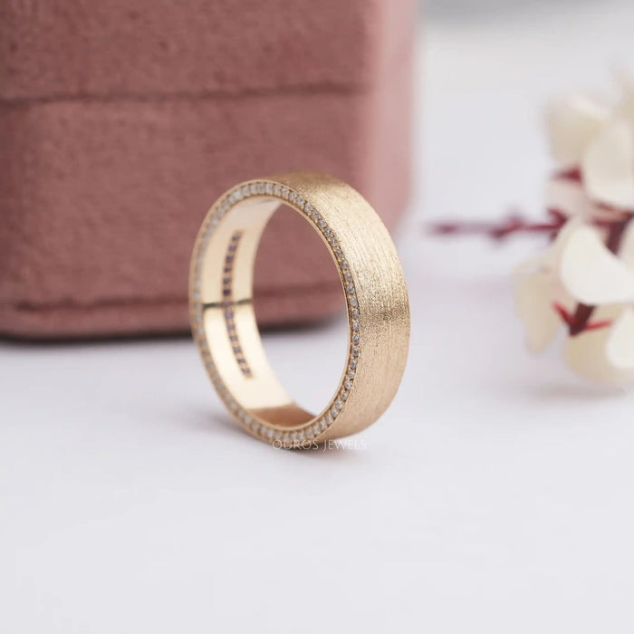 A Side View of Mens Brushed Gold Ring on soft white surface.