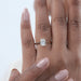 oval cut diamond solitaire button back engagement ring on model's hand