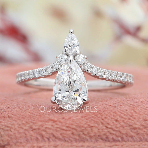 front view of chevron-shaped pear-cut diamond solitaire accent engagement ring