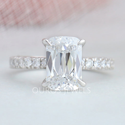 front view of criss-cut lab diamond solitaire accent engagement ring on fabric