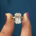 A Women Holding Criss Cut Lab Diamond Solitaire Ring