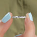 diamond eternity band holded with 2 fingers