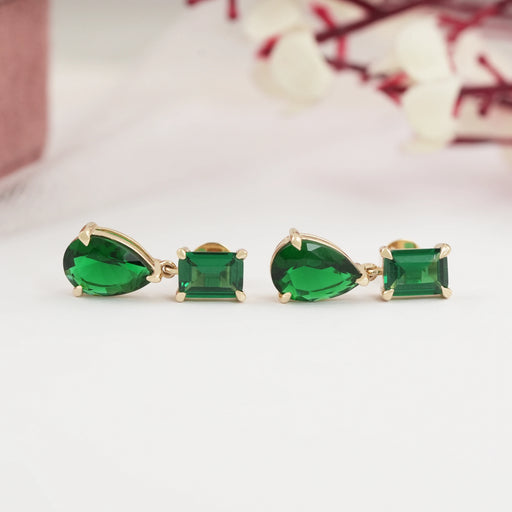 east west view of green emerald and pear gemtsone flat back drop earrings gold
