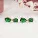 east west view of green emerald and pear gemtsone flat back drop earrings gold