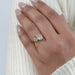 two stone pear shaped lab diamond bezel set engagement ring on model's finger