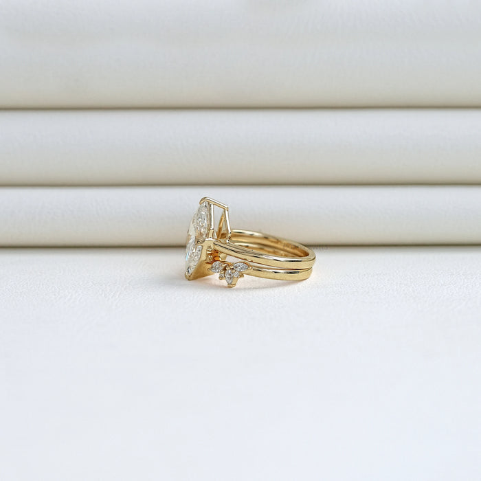 side view of dutch marquise cut lab diamond wedding ring set with yellow gold band