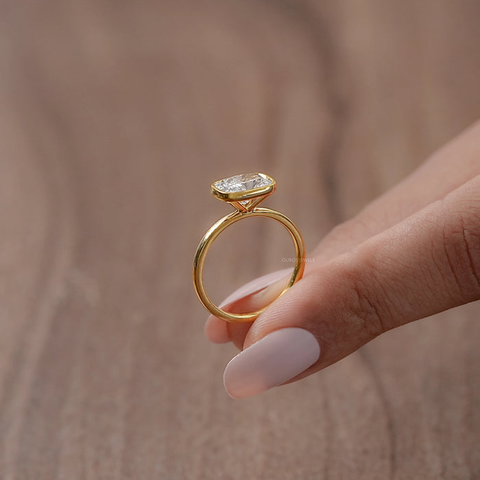 East West Cushion Diamond Bezel Set Solitaire Ring