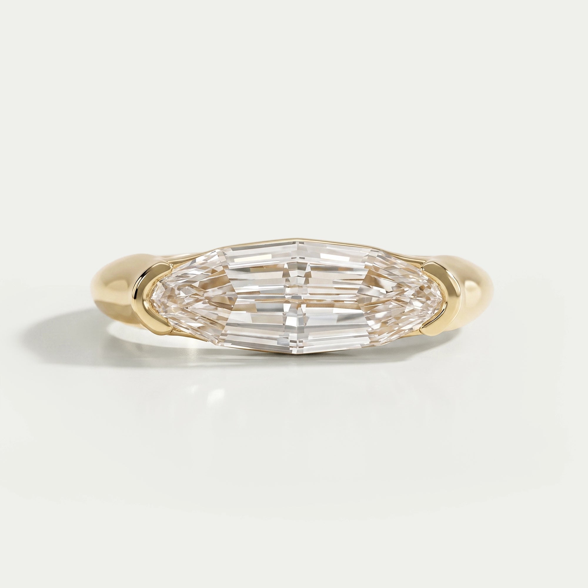 Half Bezel East West Step Cut Moval Diamond Ring Ring