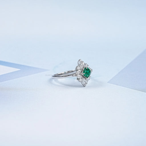 green cushion gemstone with pear diamond halo wedding ring's side view