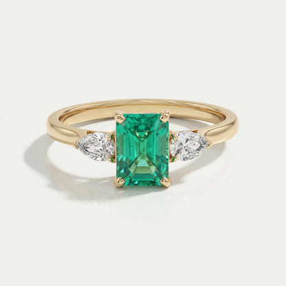 Emerald Gemstone And Pear Diamond Trio Engagement Ring