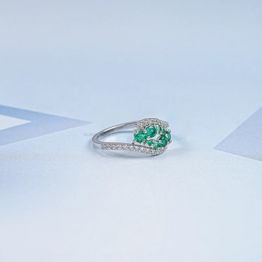 right side view of green round gemstone cluster bypass engagement ring