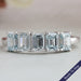 front view of light blue emerald cut lab diamond five stone wedding ring