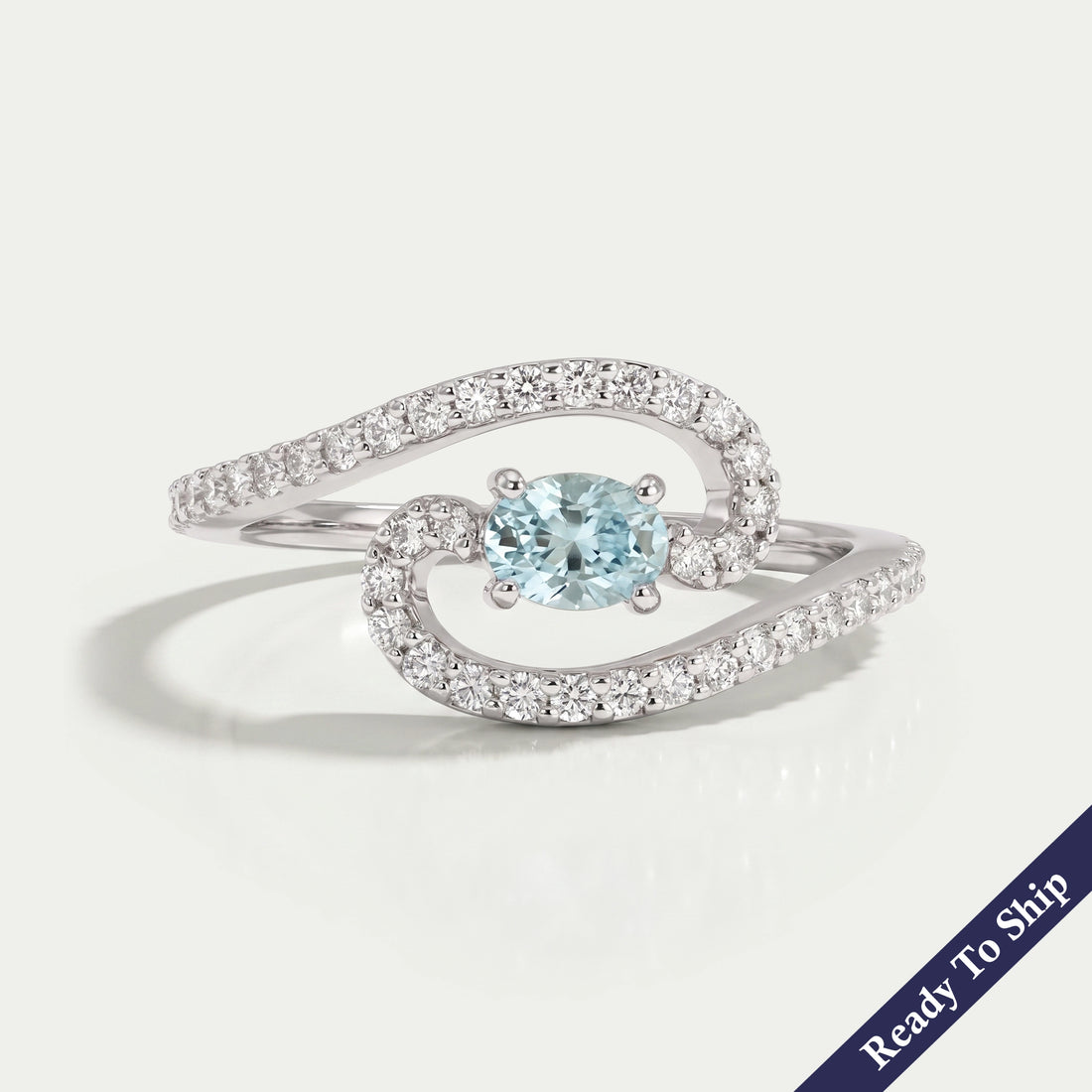 Blue Oval Diamond Bypass Engagement Ring