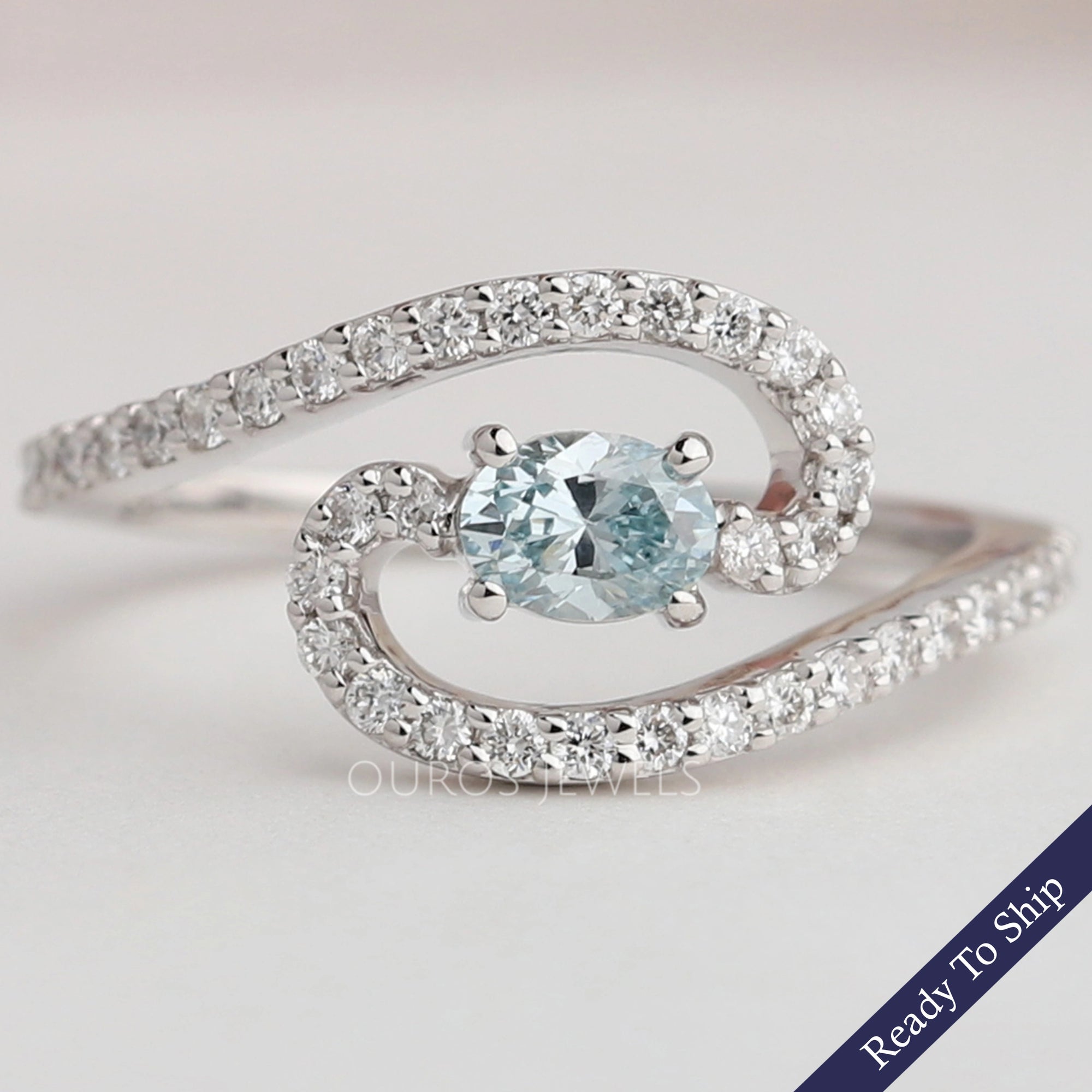 Blue Oval Diamond Bypass Engagement Ring