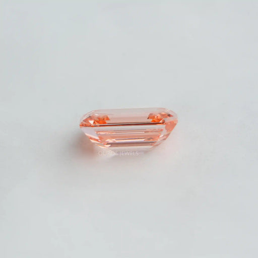 side view of pink emerald cut lab grown diamond loose