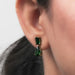 green emerald and pear gemtsone yellow gold prongs flat back drop earrings on ear