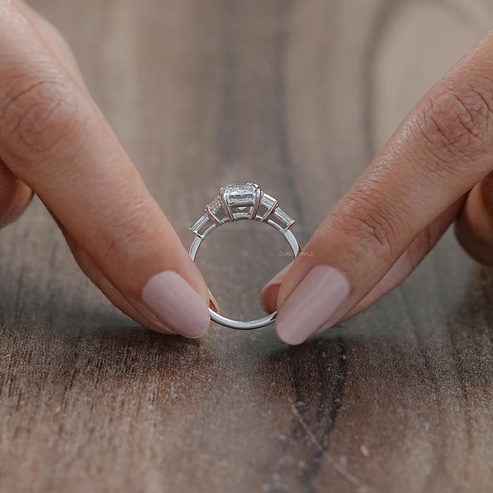 back view of emerald cut and trapezoid lab diamond five stone engagement ring