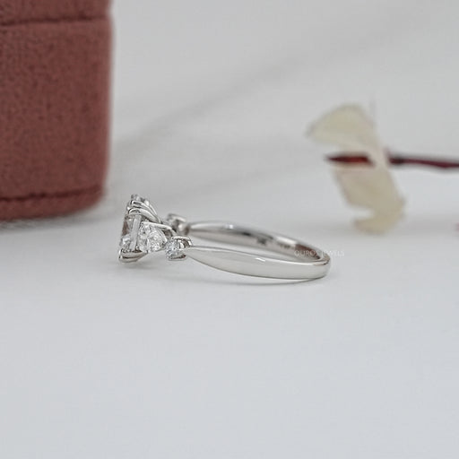 side view of oval and pear cut lab diamond five stone engagement ring