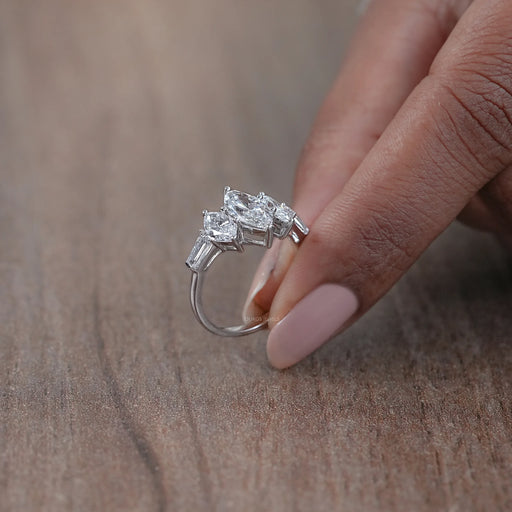 side view of marquise cut diamond five stone engagement ring with white gold band